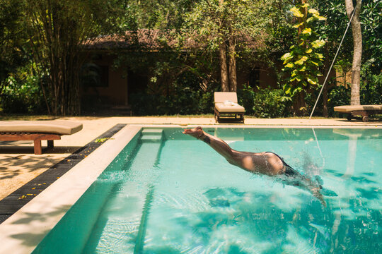 Exhilarating dive into a tropical pool