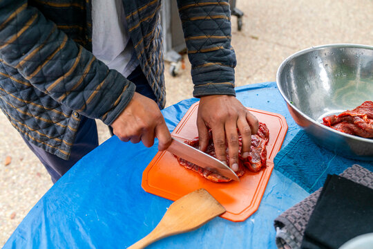 cutting raw meat 