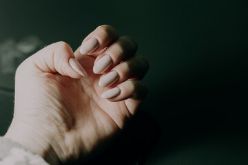 Close-up of poorly done gel manicure with visible cuticle overpainting and uneven nail polish application, educational beauty reference on nail care mistakes