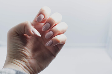 Close-up of poorly done gel manicure with visible cuticle overpainting and uneven nail polish application, educational beauty reference on nail care mistakes