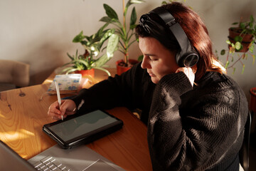 Freelancer managing tasks from home workspace