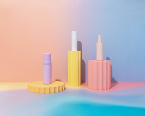 Mockup of empty pastel gradient product bottles on colorful background