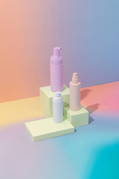 Elegant product mockup featuring pastel bottles on colorful blocks