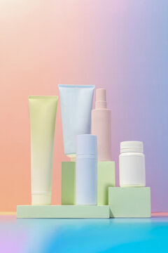 Creative mockup of empty product bottles in pastel gradient colors
