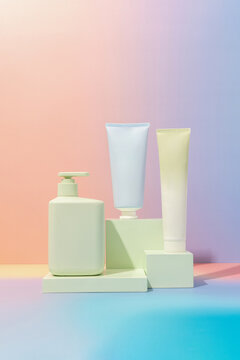 Colorful mockup of product bottles on pastel gradient background