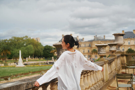 young asian woman in paris garden