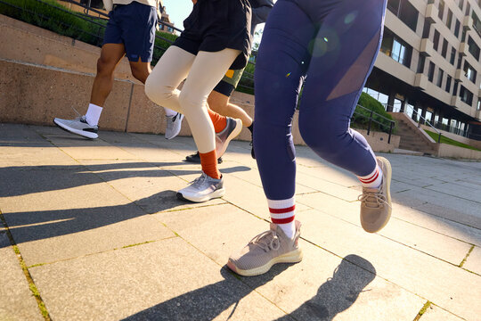 Athletes are running on the city promenade