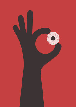 Hand holds eye