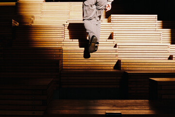 Man walking on innovative wooden staircase structure