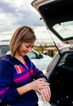 Runner woman checking smartwatch