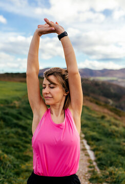 Woman stretching arms