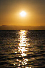 Serene Sunset Over Calm Waters: A Symphony of Colors Reflecting Tranquility