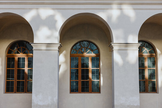 Arched Windows on Stucco Building