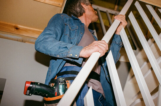 Man Assembling Stair Railing, Film