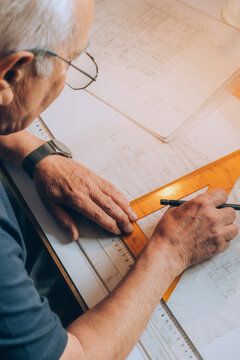 Retired man working at desk