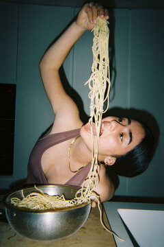 Eating spaghetti with joy


