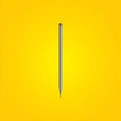 A metallic pen against a vivid yellow backdrop