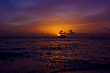 View of the yacht on the Caribbean Sea at sunset.