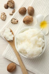 Natural shea butter on white wooden table, flat lay
