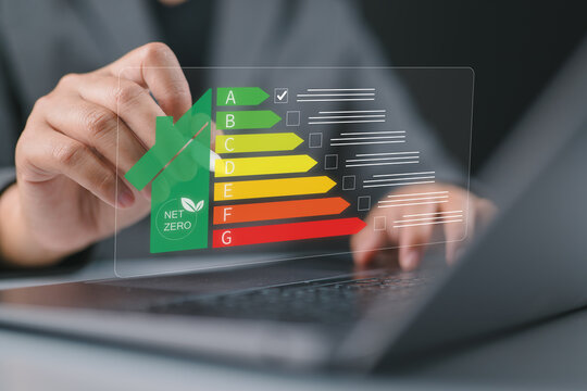 Energy efficiency Improvement concept, Eco friendly homes for sustainable development. Businessman using a laptop to energy efficiency rating assessment.