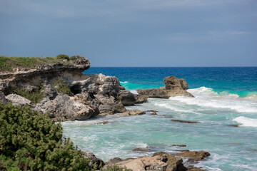 The coastline of the Caribbean Sea with white sand and rocks