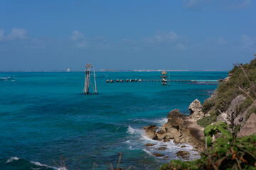 The coastline of the Caribbean Sea with white sand and rocks