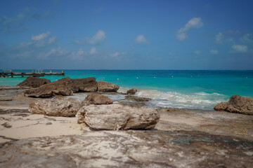 The coastline of the Caribbean Sea with white sand and rocks