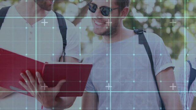 Male friend joining women sharing textbook, leading group walking campus before opening red binder