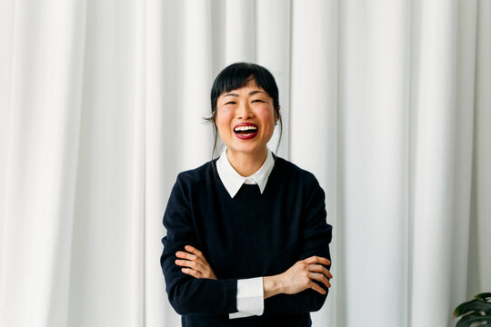 Asian woman laughing