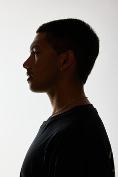 Profile silhouette of a man against a light backdrop