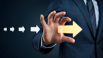 Businessman gestures towards a bright arrow signifying strategic direction, leadership, and success, with smaller arrows highlighting incremental progress and vision.