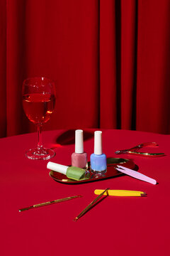 Still life of a nail polish manicure setup with tools and nail bottle