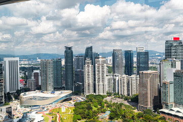 Modern skyline with green park and office buildings