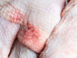 Texture of raw chicken pieces. Closeup