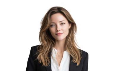 A professional young woman with long brown hair poses confidently in a black blazer against a clean. light background. suggesting a business or corporate environment