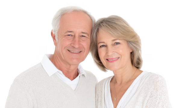 A joyful elderly couple smiles warmly at the camera. showcasing their love and companionship. set against a clean white background. perfect for family-oriented or retirement-themed projects