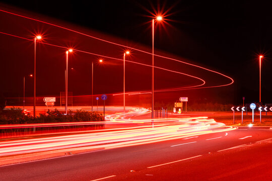 vehicle light trails on a roundabout at night