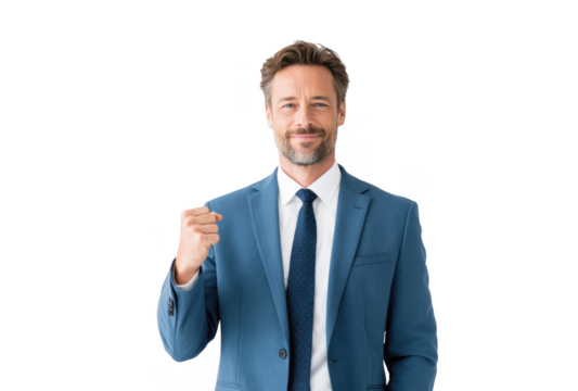 Confident businessman in a tailored blue suit celebrating success with a raised fist. against a clean white background. conveying positivity and achievement in a professional setting