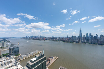 Stunning East River view of New York City skyline and iconic bridges on clear day