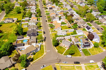 Overhead residential neighborhood with neat rows of houses, intersecting streets suburban landscape in Sayreville, Middlesex County, New Jersey