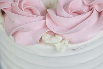 Simple elegant vanilla raspberry cake with buttercream icing