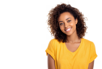 A cheerful young woman with curly hair wearing a bright yellow shirt. smiling warmly at the camera against a clean white background. perfect for lifestyle and portrait photography