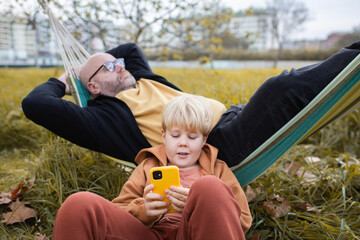 man and boy relaxing 