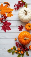 Autumn Harvest Flat Lay with White and Orange Pumpkins, Red Berries, and Vibrant Fall Leaves on Rustic White Wood Background