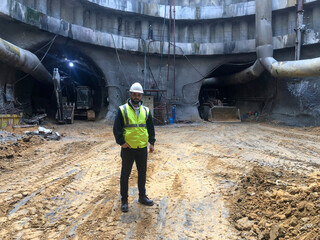Engineer Standing in Construction Site Tunnel