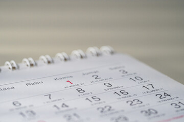 Low angle shot of a calendar lying flat, focused on the date.