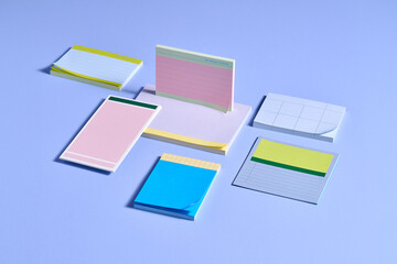 A vibrant arrangement of sticky note pads in different colors