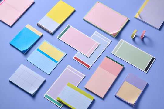 Assortment of vibrant sticky notes and colorful washi tapes