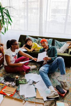 Roommates studying together at home