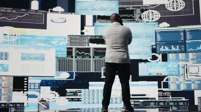 African american guy reflecting on annual financial reports for new development, reviewing the complexity of performance analysis with a focus on productivity and forecasting, AI tools. Camera A.